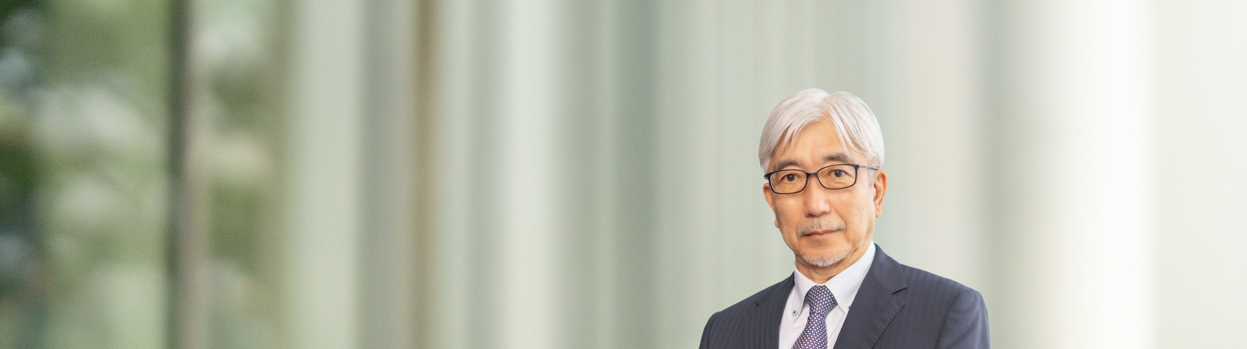 Portrait of Mitsuro Antoku (suit, tie and NISSAN corporate pin)