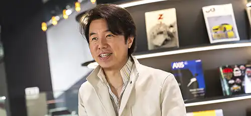 Shinichiro Irie smiling and looking forward