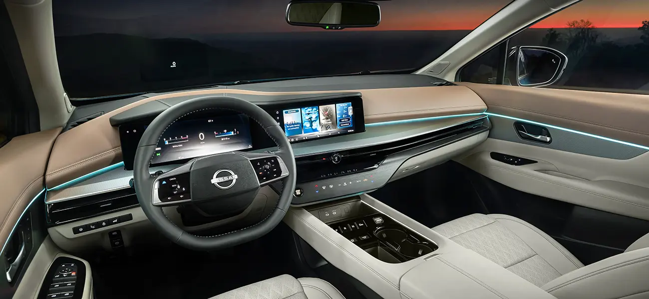 The tan, silver and white steering, dashboard, and part of the seats inside the 2025 Nissan Murano.