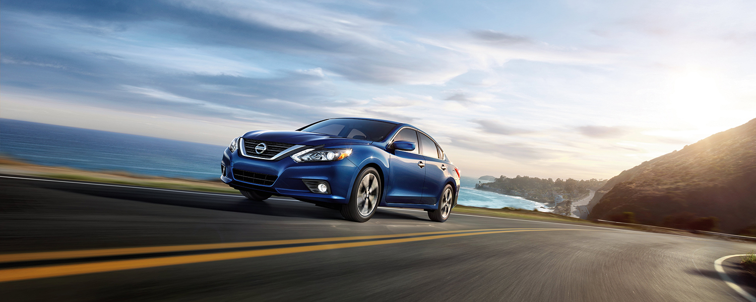 Artistic image of a Nissan Altima driving down a coastline