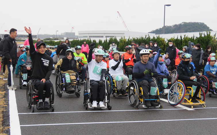 Participants in wheelchairs reading to start at race held in February 2024