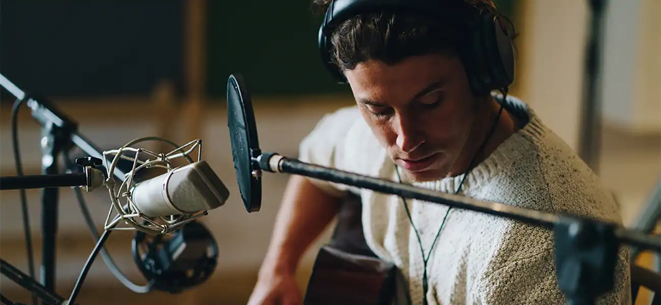 A man playing the guitar.