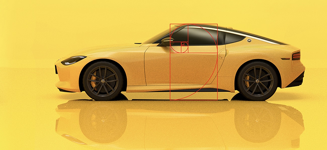 A side view of a yellow Nissan Z on a yellow background.