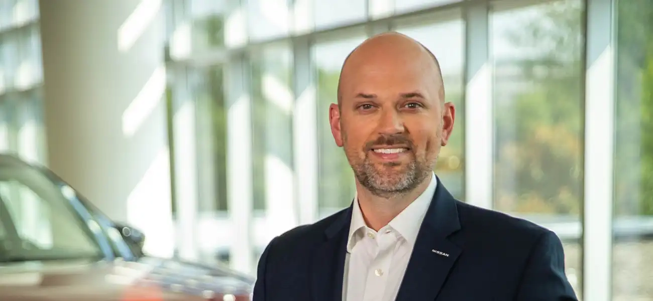 A portrait of Brian Brockman in a suit.