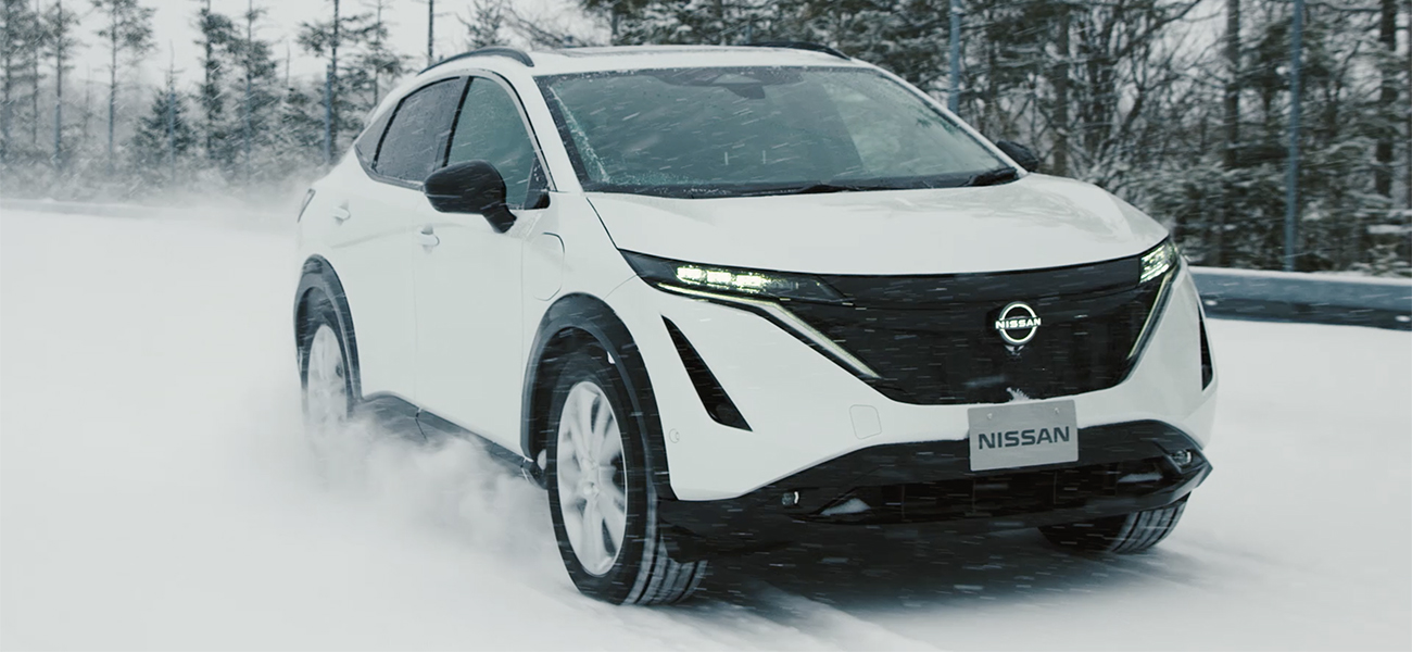 Nissan Ariya driving through snow