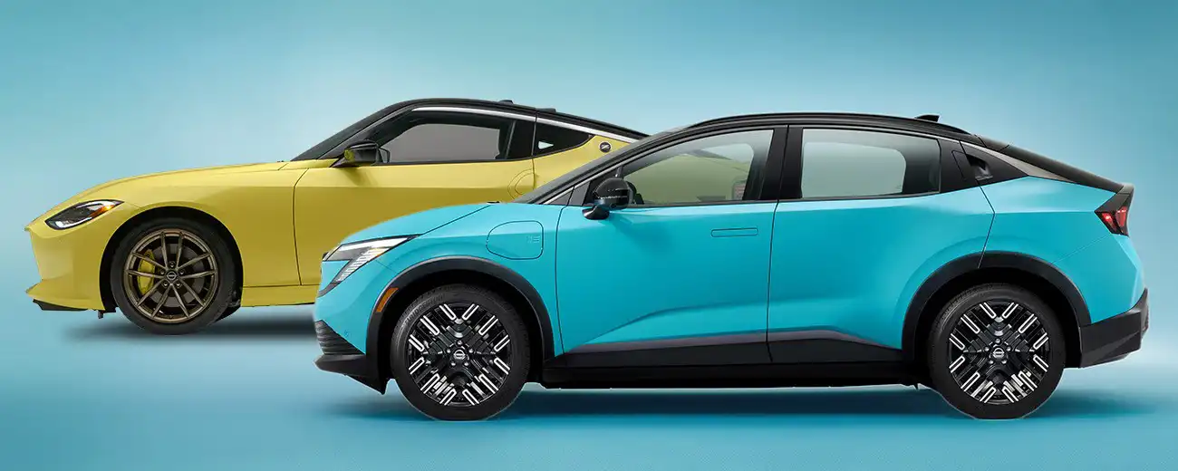 Profile views of both the Nissan Z and 2026 Nissan LEAF against a blue background.
