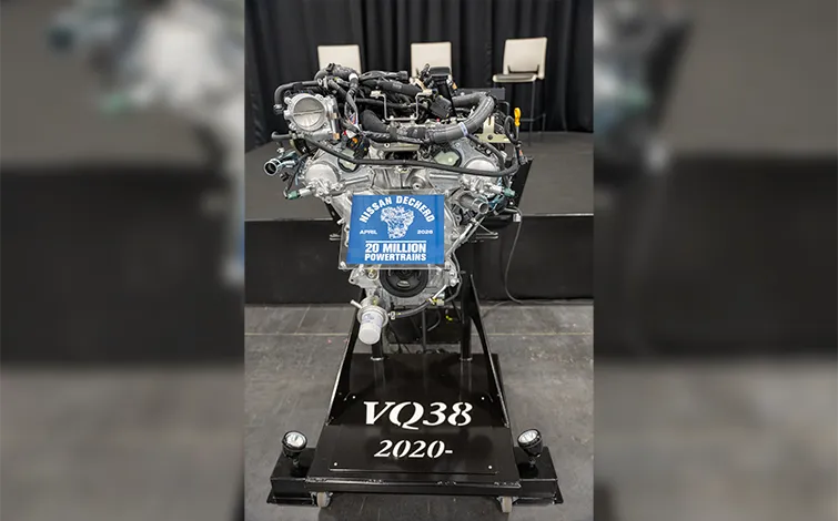 A VQ38 engine on display with a plaque that reads “Nissan Decherd, April 2026, 20 million powertrains.”