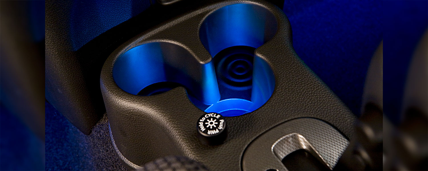 A 2009 Nissan Cube cupholders with backlit bottoms