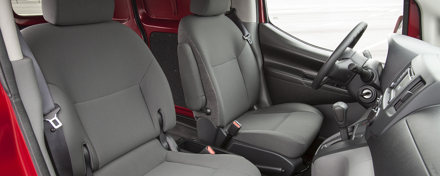 The front passenger and driver area of a Nissan NV200 Compact