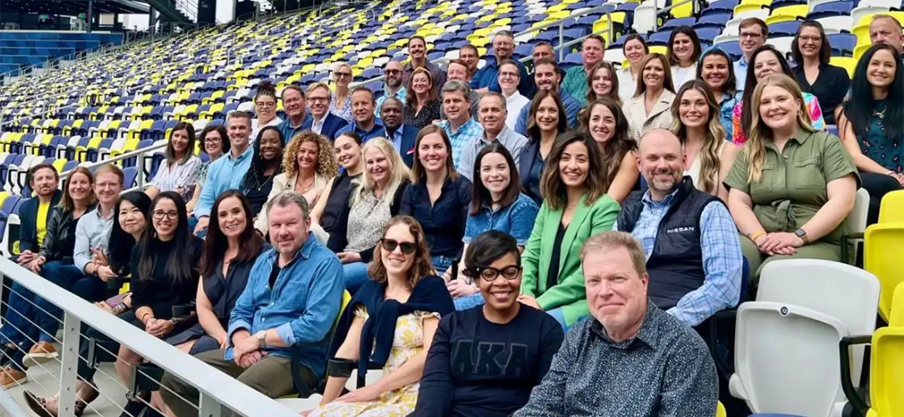 a large group of people taking a photo