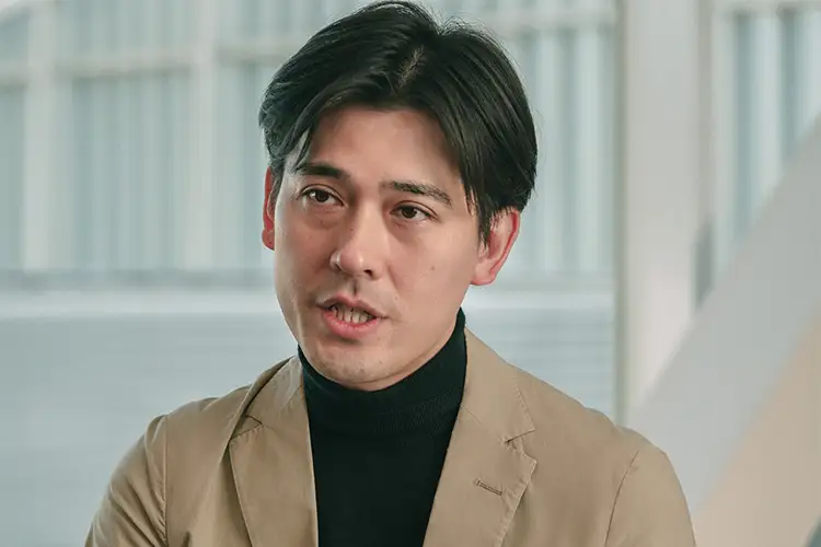 A headshot of Makoto Fukuda while giving an interview