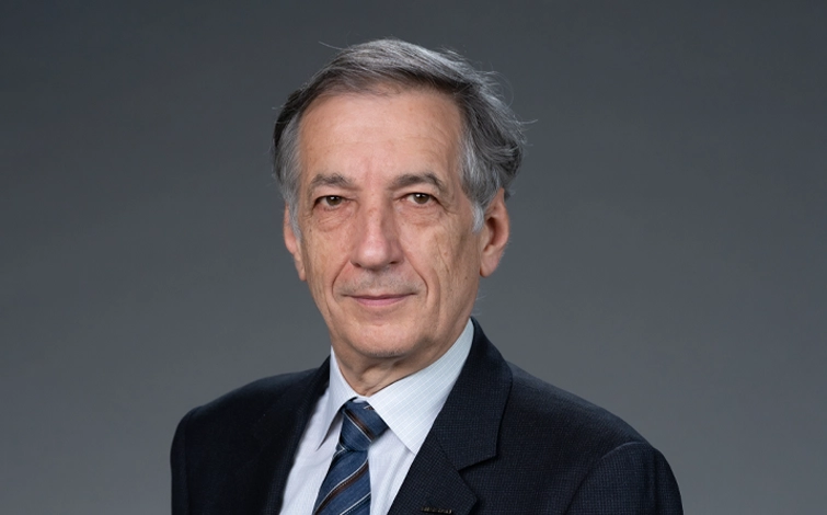 Portrait of Bernard Delmas (suit, tie and NISSAN corporate pin)