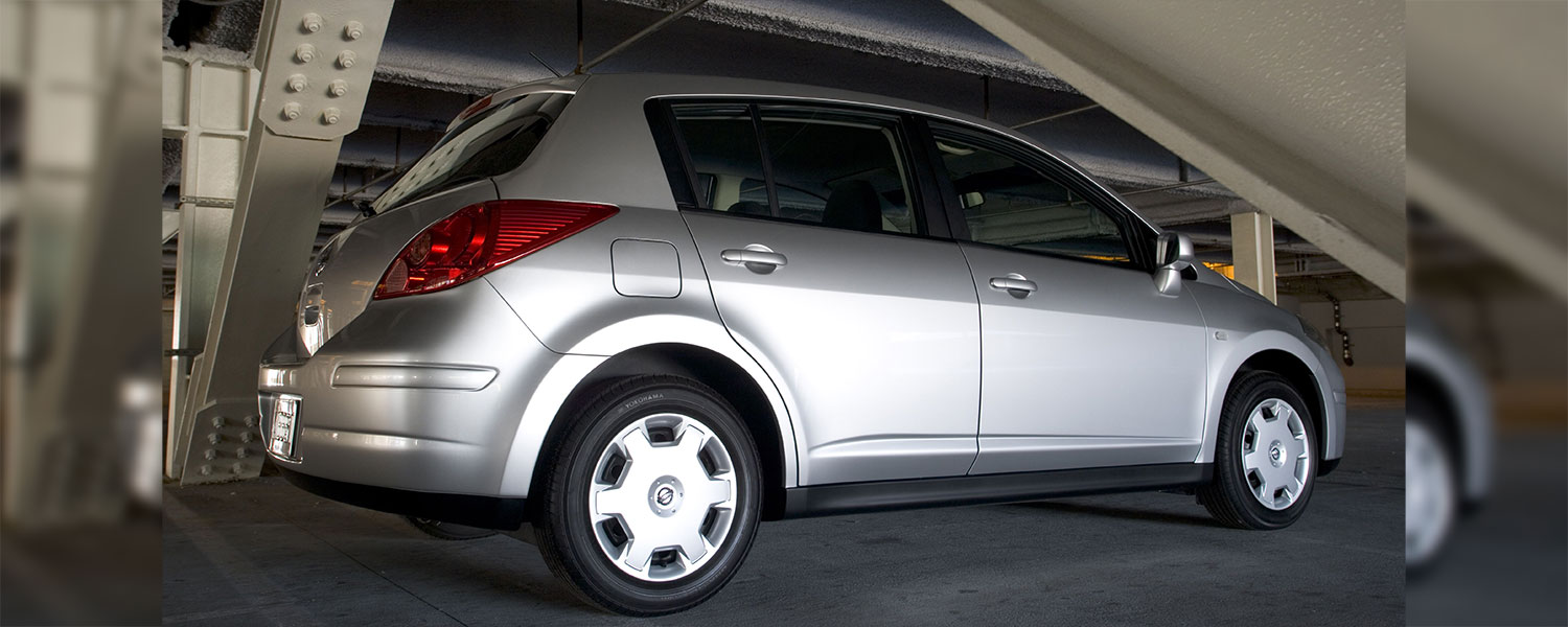 A silver Nissan Versa Hatch