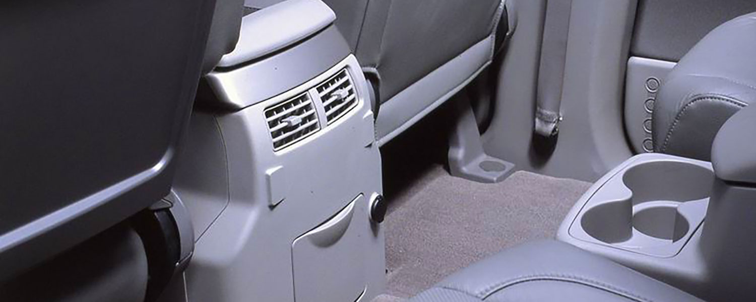 The Nissan Armadas climate vents and accessory outlet in the rear passenger area