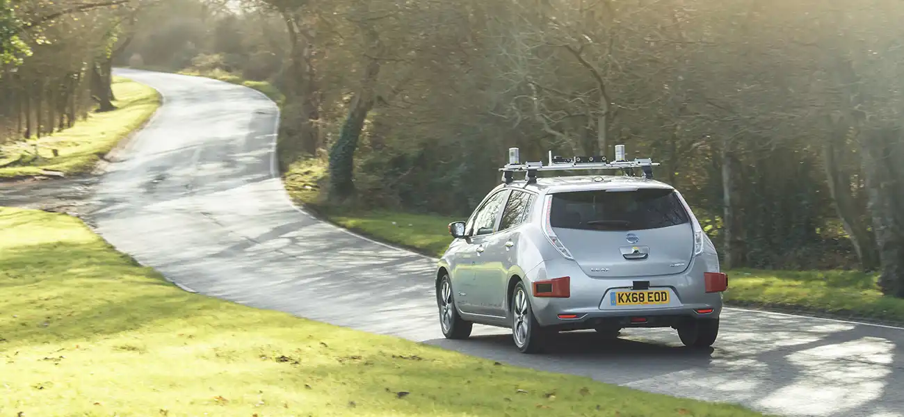 Nissan LEAF driving on a country road.