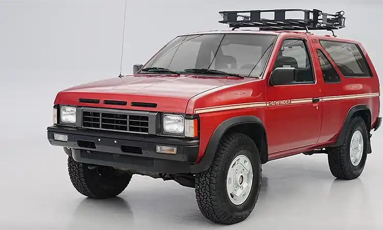 3/4 view of a Red Nissan Pathfinder