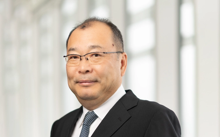 Portrait of Shohei Yamazaki (suit, tie and NISSAN corporate pin)