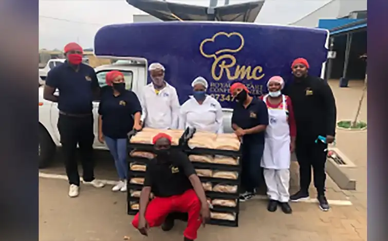 Worked from Royal Mozart Confectioners pose for a photo