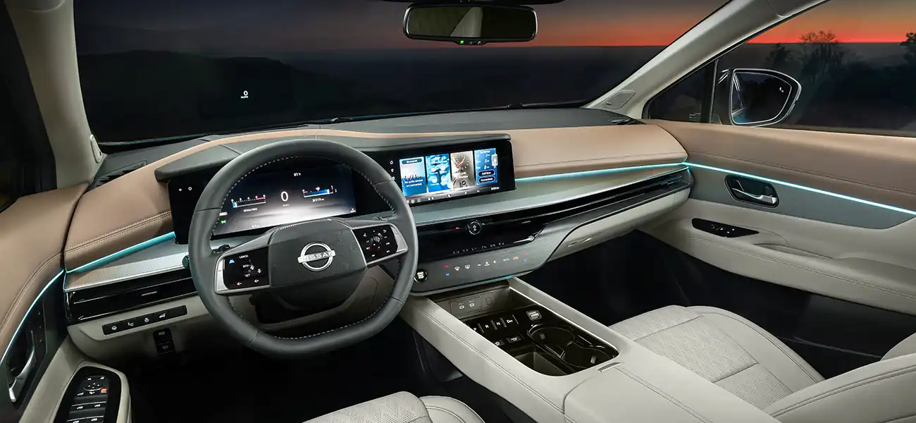 The tan, silver and white steering, dashboard, and part of the seats inside the 2025 Nissan Murano.