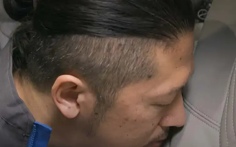 Ryunosuke Ino smelling upholstery