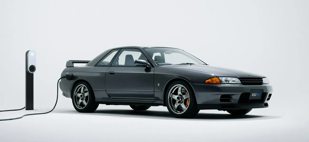 R32 GT-R EV charging in front of a white backdrop
