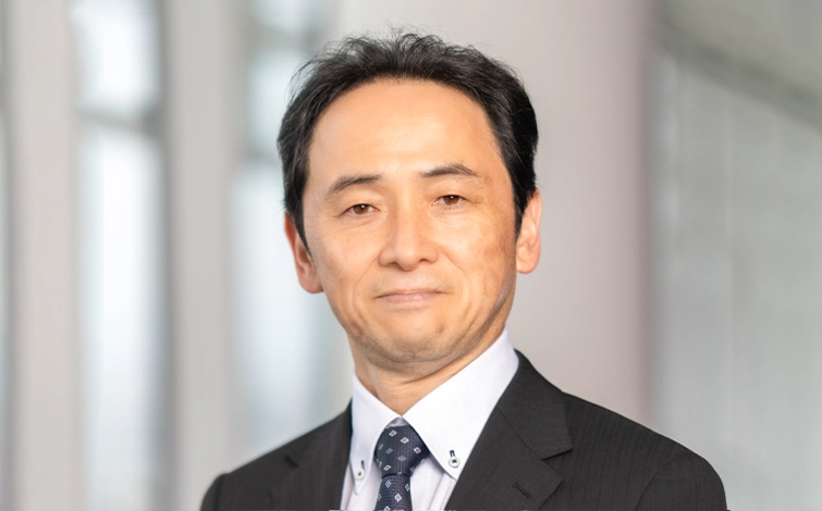 Portrait of Eiichi Akashi (suit, tie and NISSAN corporate pin)