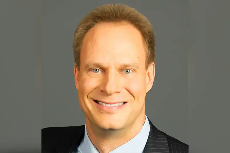 A headshot of Mark Swenson