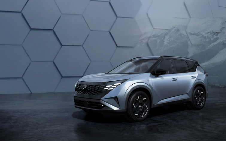 In a subdued setting with a geometric-patterned wall, a silver X-Trail / Rogue is shown stationary, facing slightly forward at an angle.