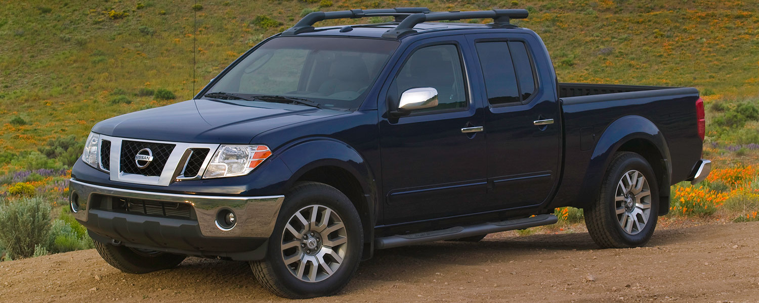 A 2009 Nissan Frontier parked off-road