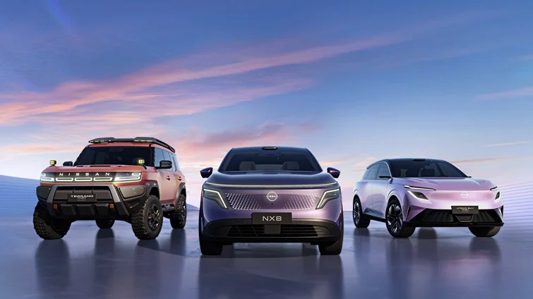Three vehicles are lined up side by side, facing forward on a smooth surface under a dusk sky. From left to right: the rugged Terrano PHEV Concept, the NX8 in the center, and the sleek Urban SUV PHEV Concept on the right.