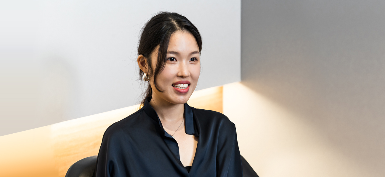 A portrait of Ahn in a black shirt.