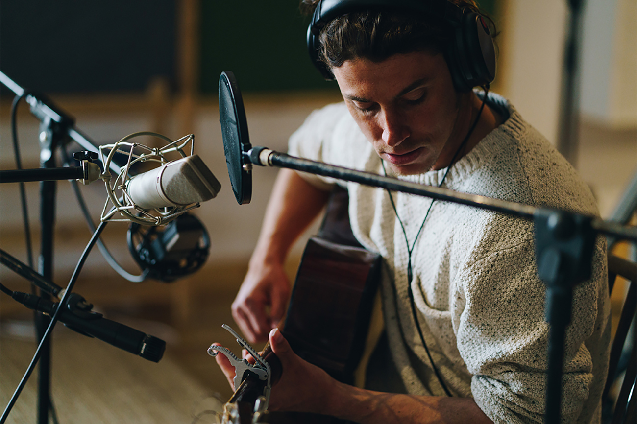 A man playing the guitar.