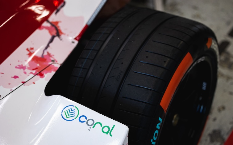 Close-up of the Coral logo by the rear wheel of the Nissan Formula E race car