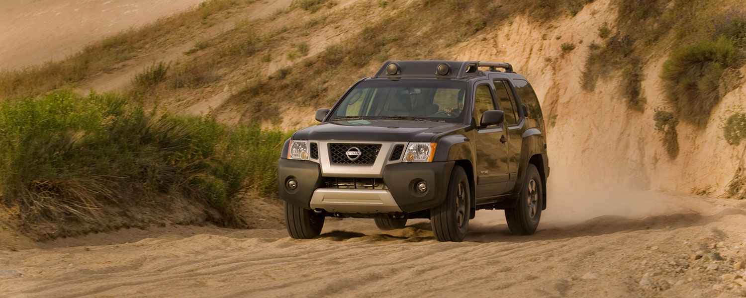 A 2010 Nissan Xterra driving off-road