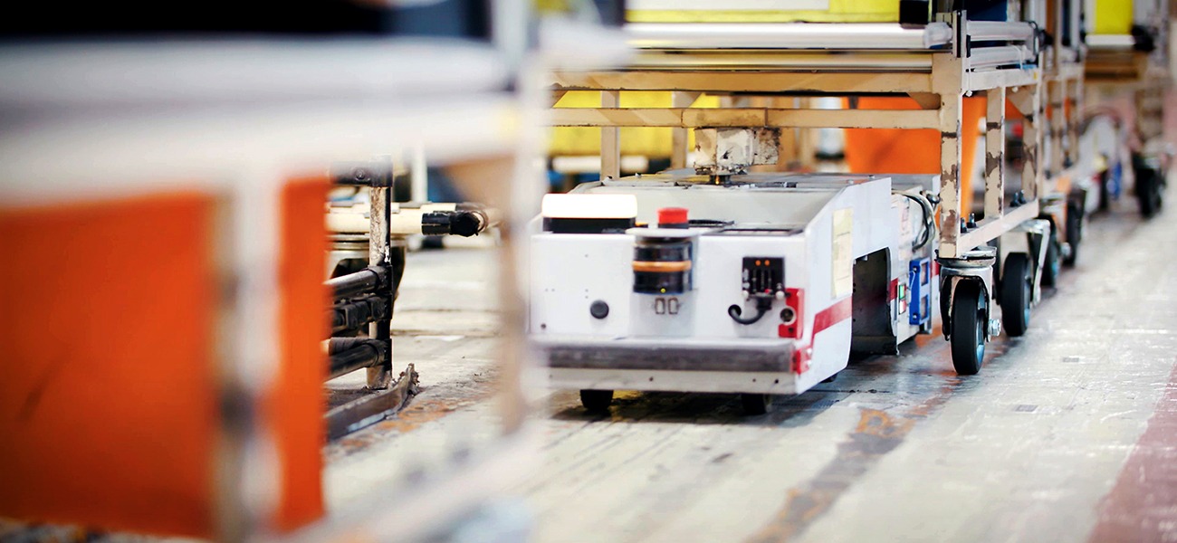 Nissan LEAF’s lithium-ion batteries lined up in a factory.
