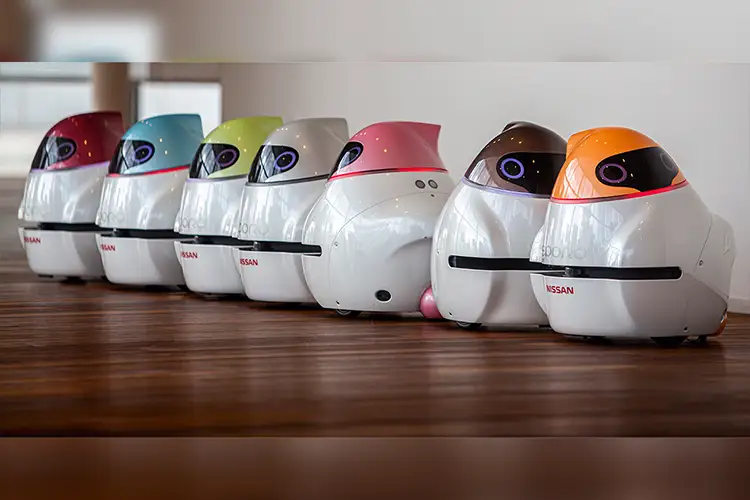 7 Eporo Nissan robots standing on a hardwood floor