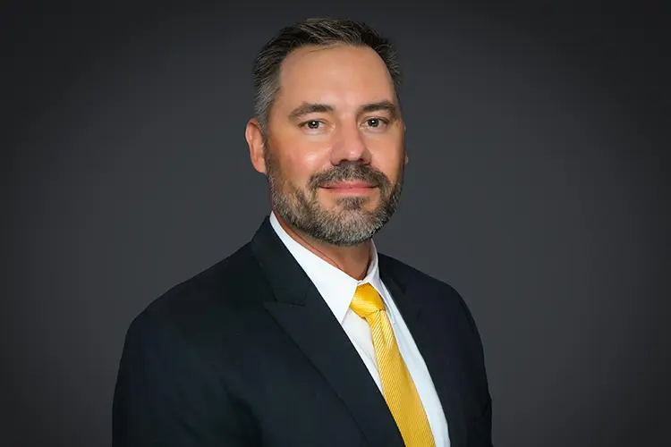 A headshot of Brian Crockett