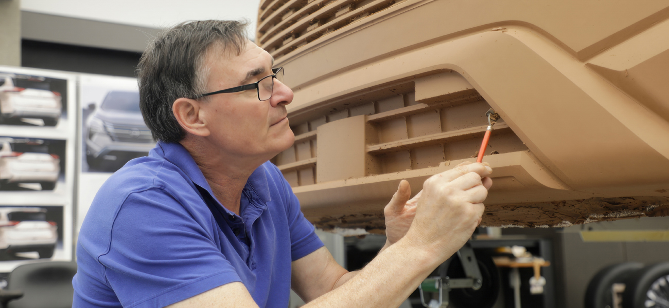 A designer working on a new model of 2024 Rogue.
