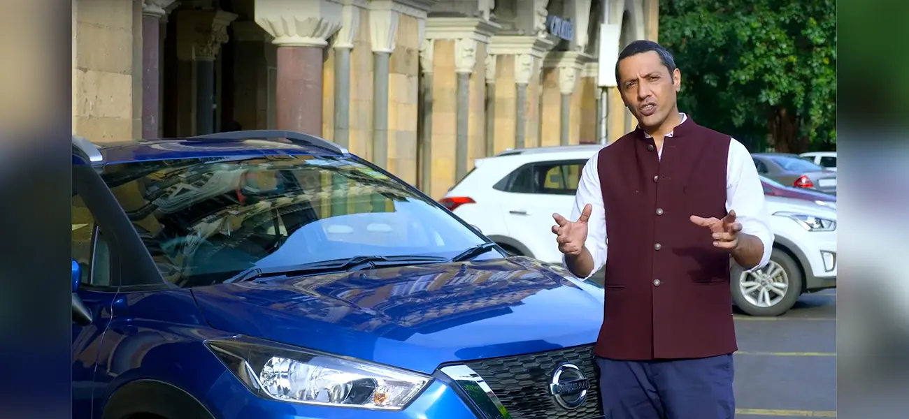 Celebrity chef Aditya Bal standing in front of a Nissan KICK