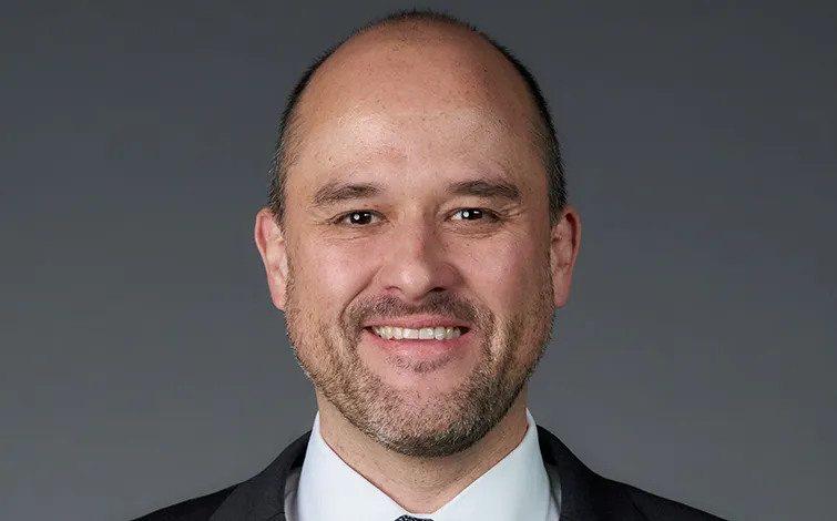 Portrait of Ivan Ivan Espinosa (suit, tie and NISSAN corporate pin) (front)
