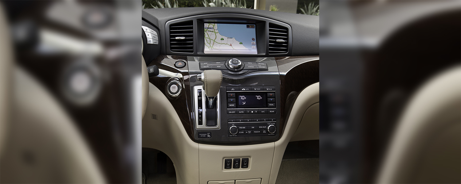 A Nissan Quest center console and radio controls