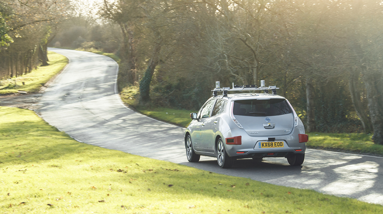 Nissan LEAF driving on a country road.