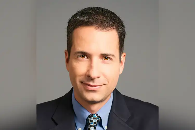 A headshot of Andrew Tavi