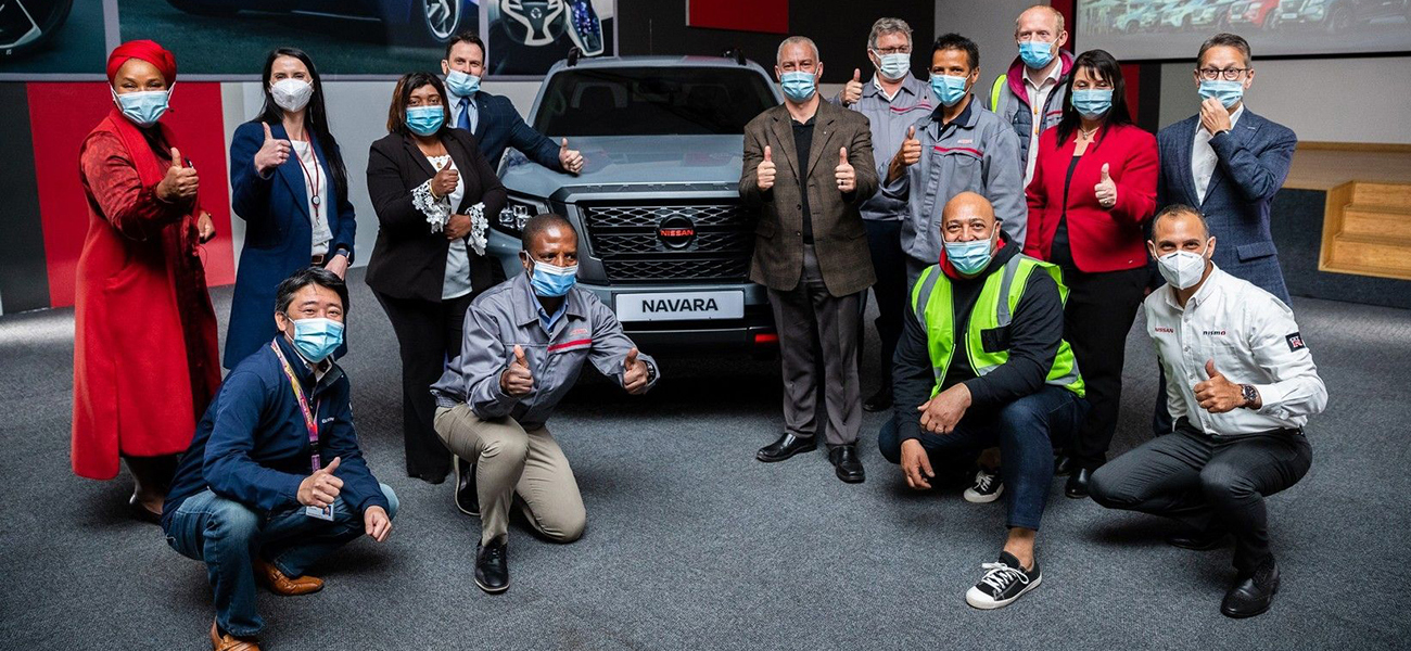 Group of Nissan employees posing for a photo