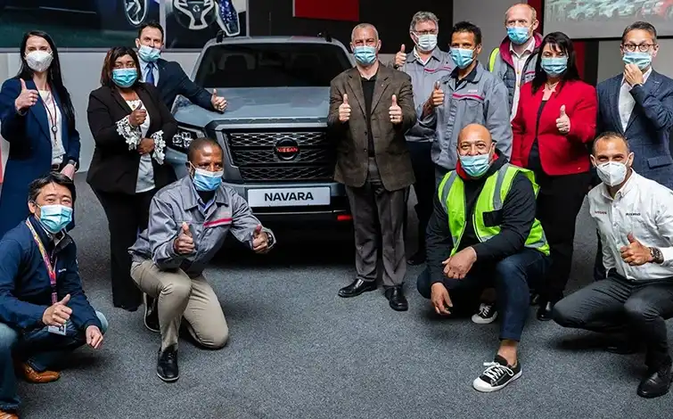 Group of Nissan employees posing for a photo