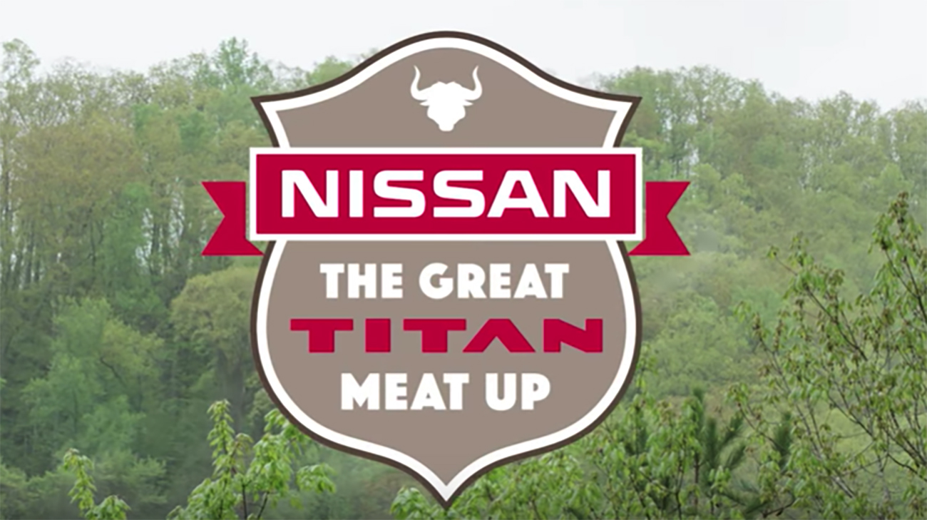 An image with a logo of Nissan the great Titan meat up with a green forest in the background.