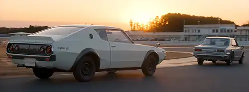 Two classic GT-R's on a track