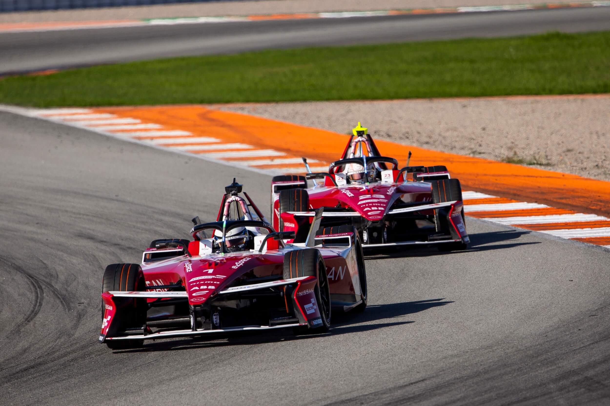 Oliver Rowland in the #1 Nissan e-4ORCE 05 in front of Norman Nato in the #23 car on-track during Season 12 Pre-Season Testing in Valencia.