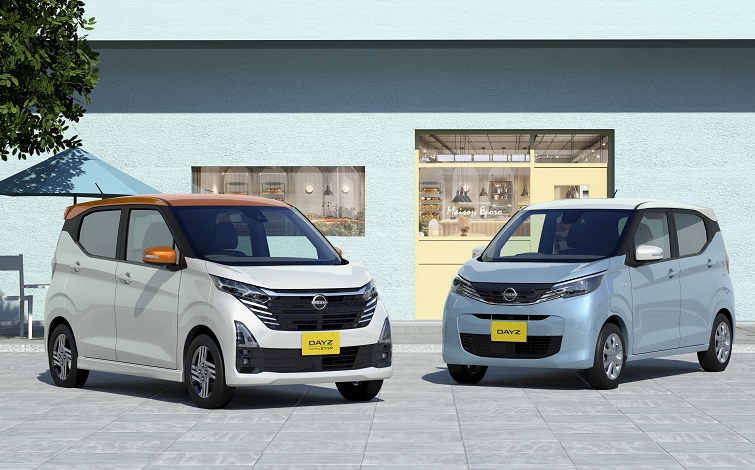 白いビルを背景に2つのデイズ（ホワイトパールとシャーベットブルー）が斜め向かい合って並んでいる