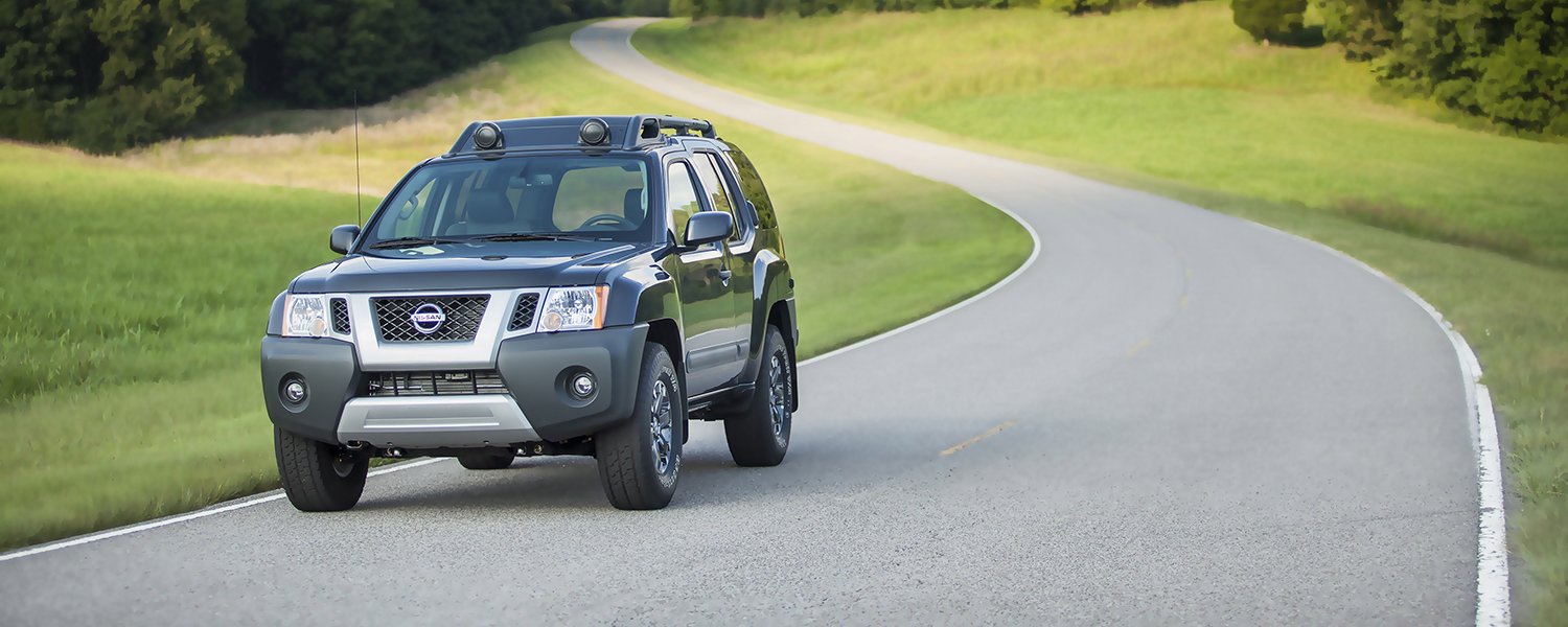 A black Nissan Xterra parked on the road